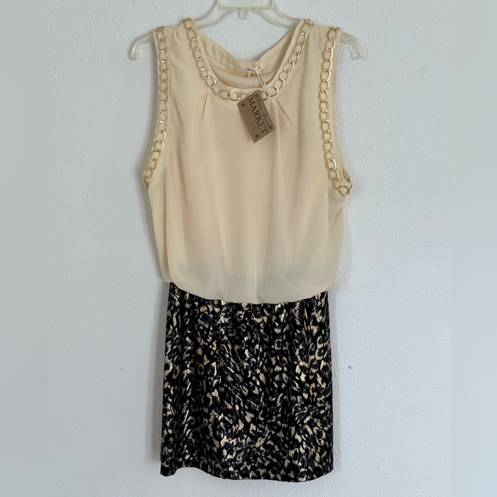 Dress purchased from boutique. Cream, gold and black colors.